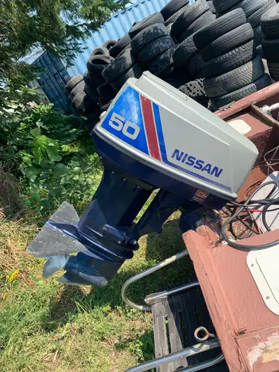 Older Nissan 50 2 stroke outboard , the engine runs and sounds pretty good , could use an impeller a...