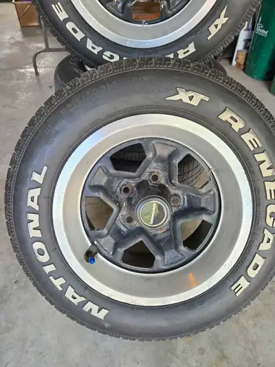 Set of '1980's Rims complete with tires, centre caps, and Brushed Aluminum trim rings. 215 60R14 tir...
