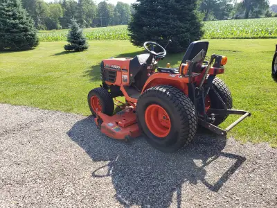 2003 Kubota B7500. 60 inch deck and 51 inch blower with B2731 quick hitch. 4 wheel drive, turf tires...