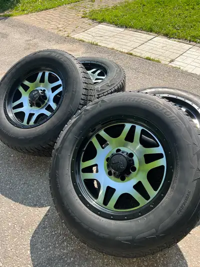 These are a set of used Black Iron Brawler wheels paired with Bridgestone Blizzak tires, that should...