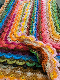 Multi coloured crochet baby blanket 