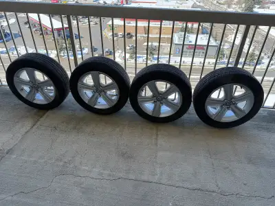 Selling a set of used Volkswagen rims with tires, perfect for winter or all-season use and will fit...
