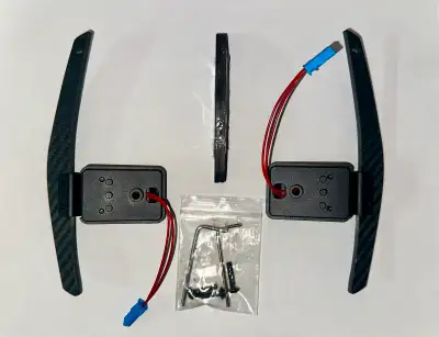 I have a pair of brand new Carbon Fiber magnetic paddles shifter that comes with 2 extra smaller pad...