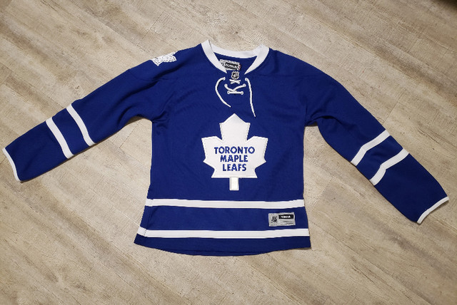 Toronto Maple Leafs replica Reebok jersey (womens large) in Women's - Tops & Outerwear in Saint John