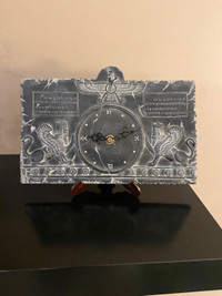 Ancient style farahvar symbol as mantle quartz clock 