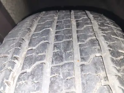 Selling one GMC factory 18-inch alloy rim with a mounted Goodyear Wrangler HP 275/65R18 tire. Good a...