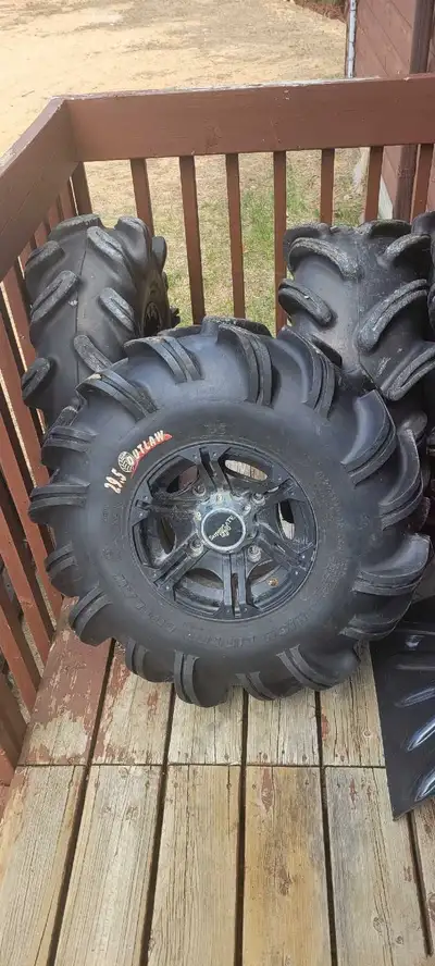 4 ATV Tires on Aftermarket SuperATV Rims – Staggered Setup Front: 29.5x10-12 Rear: 29.5x12-12 Came o...