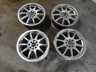 4 Aluminum rims 15x7 4 stud bolt pattern 98mm and 108mm. no damage not even curb rash. they were on...