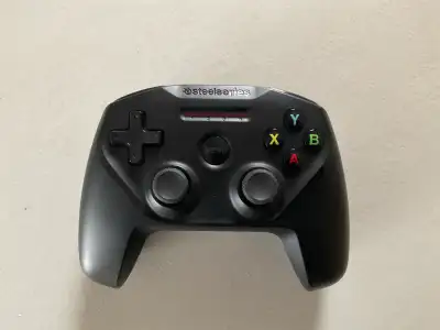Lightly used SteelSeries Nimbus wireless gaming controller. Works with Bluetooth and ideal for Apple...