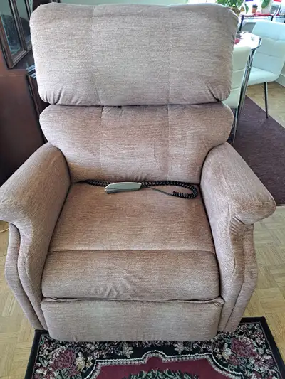 Electric therapeutic lift chair for those who have trouble getting up out of a chair. Reclines almos...