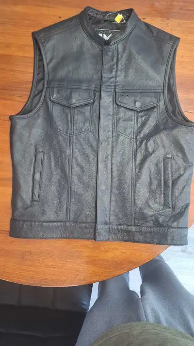 Leather riding vest, large never worn tag still on. $100. STC 6"tall leather boots never worn 9.5. M...