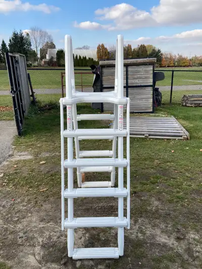 above ground a frame pool ladder in/out 54inch wall gently used for one season