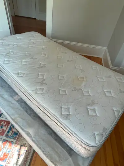 Sears plush single mattress and boxspring from pet free and smoke free home. Small light stain on ma...