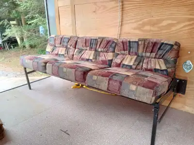 The unit can be attached to your trailer wall. It is a sofa that converts to a 76 inch by 33 inch be...