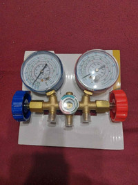Refrigeration manifold with gauges and adaptor hoses