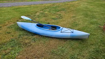 Nine (9) foot kayak with paddle Rigid, hard shell, sit in, sit inside model. Nothing wrong with it.