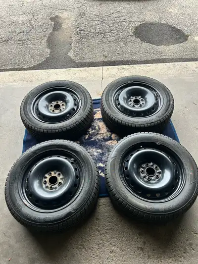 Winter command. Used only for 1 season. Like new 4 tires and 4 new black steel rims. Lots of tread....