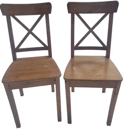 2 matching solid wood dining chairs. Dining room furniture., View more