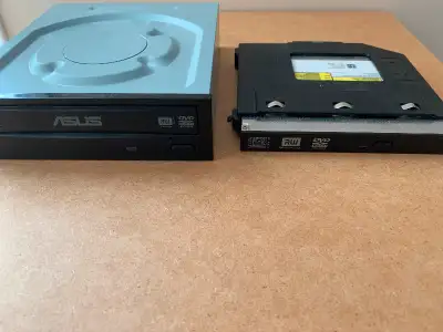 2 Disc Drives as shown . Small black one is a DELL for a laptop drive ... Big grey one is a ASUS .....