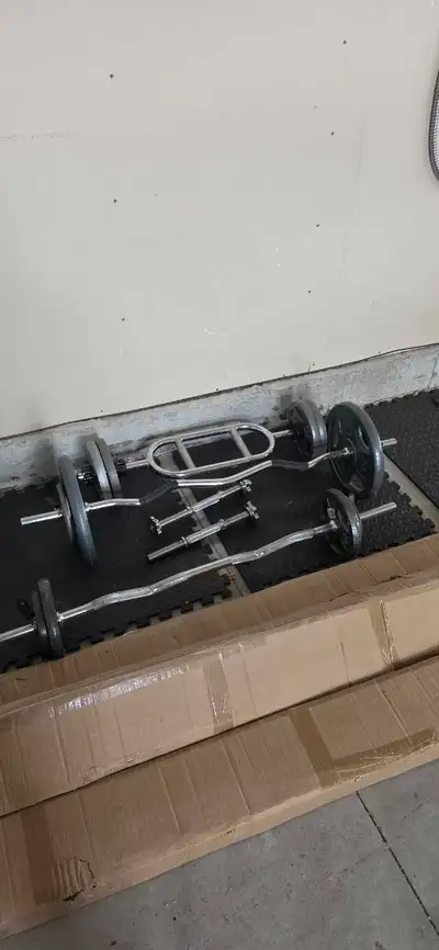 Over 750lbs in plates, dumbbells and handles.