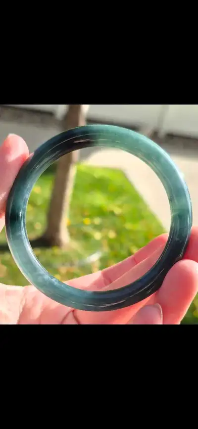 Grade A, true jade (jadeite) Bangle. Green/teal translucent, icy princess cut round. Comes with cert...