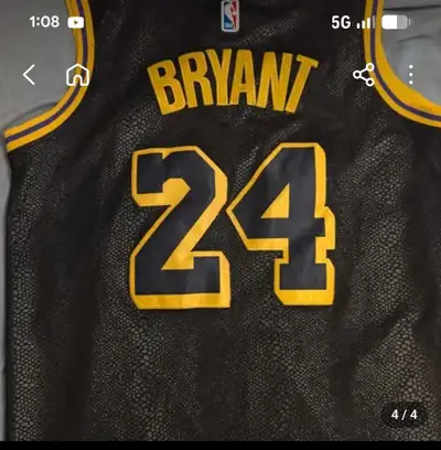 Iconic Kobe Bryant 24 jersey. Black and yellow colors. Has that cool snakeskin texture, like the Mam...