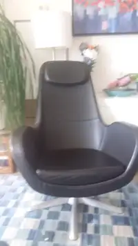 Ikea black leather Arvika armchair and ottoman