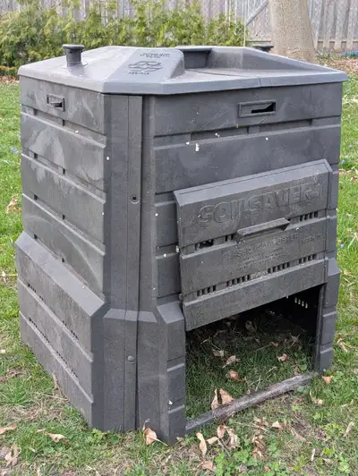 Large backyard composter, sliding access panel for removing bottom layers, locking lid. In good shap...