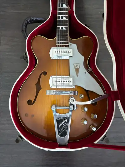 This thinline hollow body was made in Chicago in 1960. The legendary “Kleenex box” pickups sound fan...