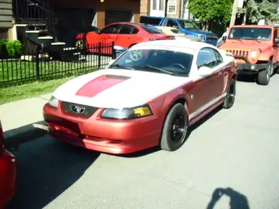 mustang 2001 v6 automatique , 157000 km. rien a faire , tout fonctionne parfaitement ainsi que a/c ,...