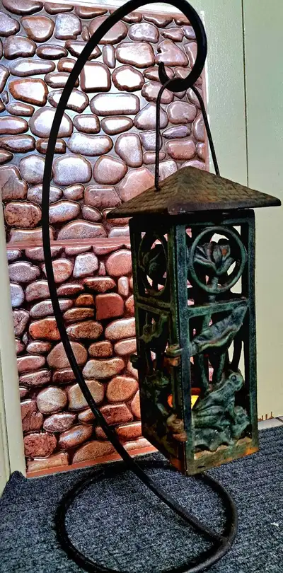 This eye-catching garden lantern features charming frog and floral accents, perfect for adding a whi...