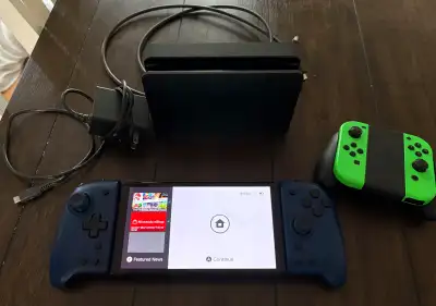 Switch OLED has been factory reset and comes with joycons and joycon grip, dock, power adapter and H...