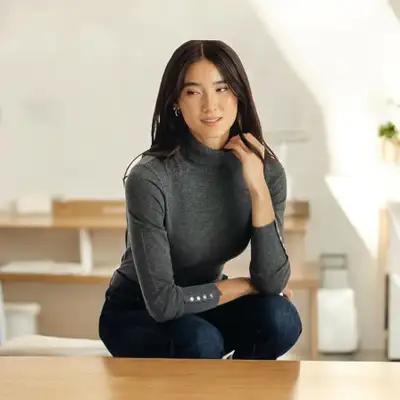 NWT Ricki's gray cashmere-blend turtleneck sweater with ribbed cuffs with decorative rivet details....