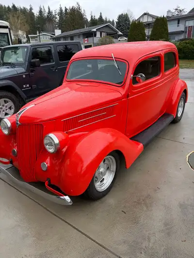 Feast your eyes on this stunning, used 1936 Ford Slant back sedan, a true classic that has been lovi...