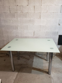 Glass top dining table with metal legs