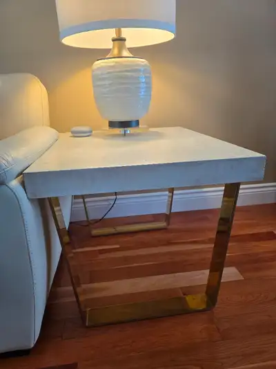 Custom solid concrete coffee table & end table with polished brass trapezoid legs. Layered sedimenta...
