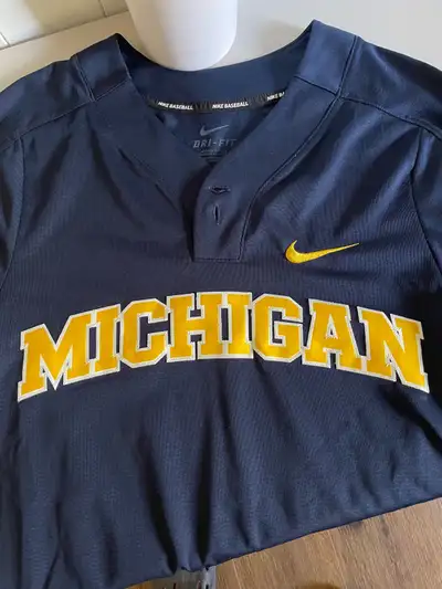 Brand new never worn Michigan baseball jersey. Nike dri-fit. Size men’s small.