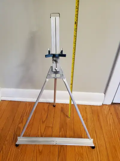 Aluminum art easel. Roughly 2 feet tall. A few nice things about this easel. First, it's metal, maki...