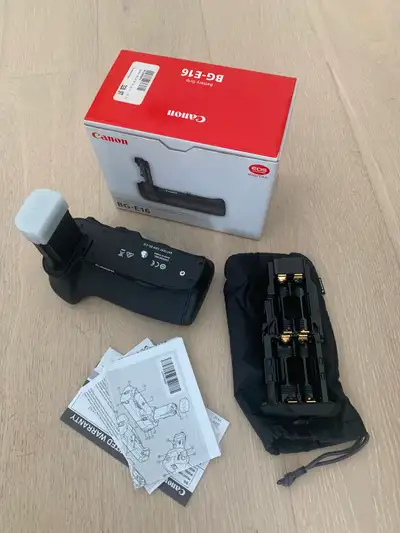 The Battery Grip BG-E16 for the EOS 7D Mark II holds two LP-E6N battery packs, or six AA batteries,...