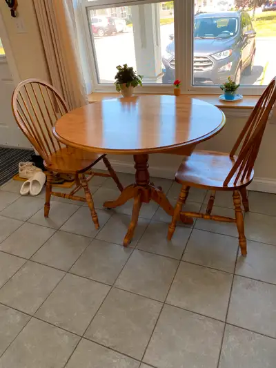 Round Kitchen Table Drop Leaf Table is scratch free. Chairs are worn Call after 6 PM