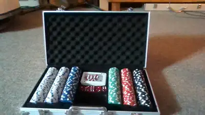 Poker chip set of 300 chips in aluminum case in good condition.