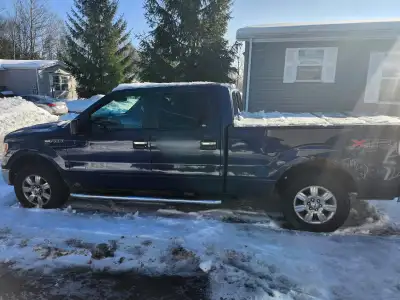 2011 Ford F150 XTR - Has rust on all four wheel wells, rockers on both sides and truck bed. Various...