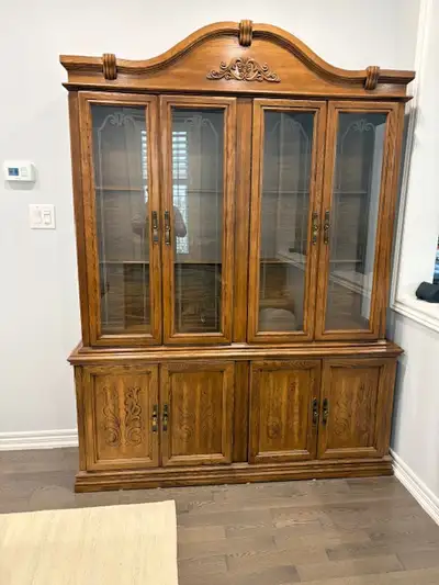 Solid wood dining table and matching hutch for sale Both units are in good condition – no major scra...