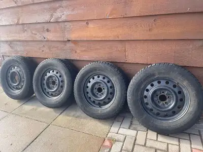 IRONMAN POLAR TRAX WINTER TIRES 235/65R17 MOUNTED ON STEEL RIMS bolt pattern of 5x114.3 (off a Ford...