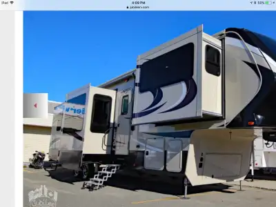 2012 Dodge Dually and 2016 Solitude by Grand Design fifth wheel trailer. The trailer has 5 slides, d...