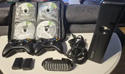 Xbox 360 Slim - 250Gb Internal HDD - 2 Charger Cable + Rechargeable Battery Pack - 1 Chat pad - 2 Co...