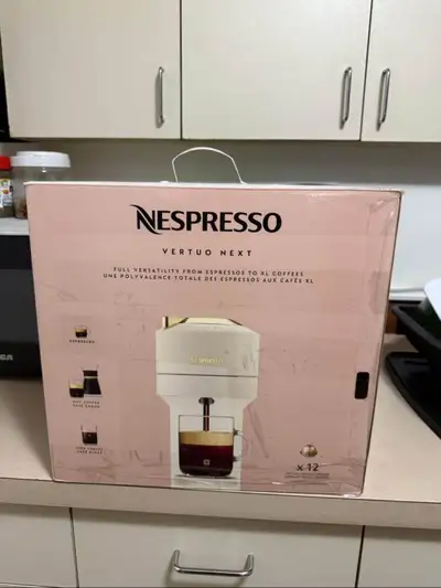 Vertuo Next Full White & Gold - good condition - working machine -No damage it Ps if you are interes...