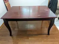 Sturdy wooden table with one leaf
