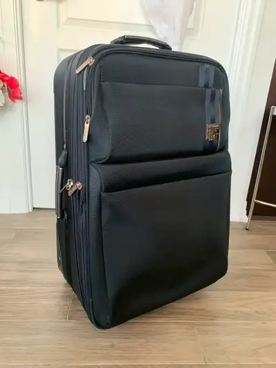 Luggage/ suitcase for sale. Has lots of pockets inside. Pick up near square one mall. Please check o...