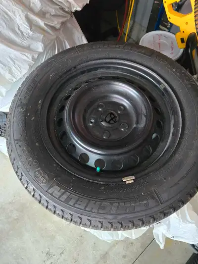Winter tires on Rims. Used 2 seasons. 205/65 R16. Fits a Camry.
